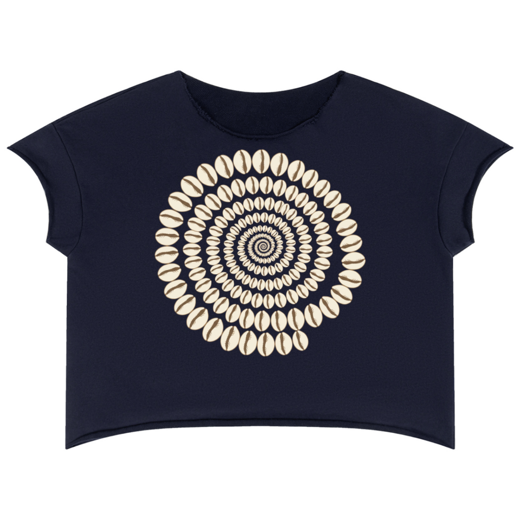 A navy blue short-sleeve crop top featuring a large circular mandala-style graphic made of cream-colored cowrie shells on the front, displayed against a solid white background.