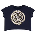A navy blue short-sleeve crop top featuring a large circular mandala-style graphic made of cream-colored cowrie shells on the front, displayed against a solid white background.