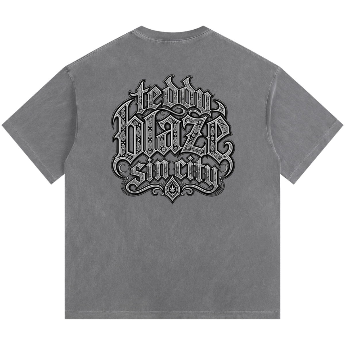 Elevate your casualwear with the Teddy Blaze Sin City Sacred Vintage Washed Cotton Tee. Charcoal gray heavy cotton, vintage wash, tattoo praying hands print, and ornate back graphic. Shop NYC to Vegas style.