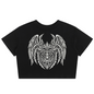 A black short-sleeve crop top t-shirt featuring a large white tribal-style graphic of a horned, winged creature on the chest, displayed against a solid white background.