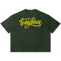 Shop the Signature Boxy Tee by Teddy Blaze. 220 GSM cotton-poly oversized drop-shoulder t-shirt with yellow script logo from TOPS BY TEDDY BLAZE.