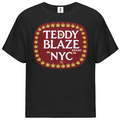 A black short-sleeve crewneck t-shirt featuring a large graphic on the chest. The graphic is a dark red rounded rectangle with white text reading 'TEDDY BLAZE BRAND NYC' and a border of yellow cannabis leaves, set against a plain white background.
