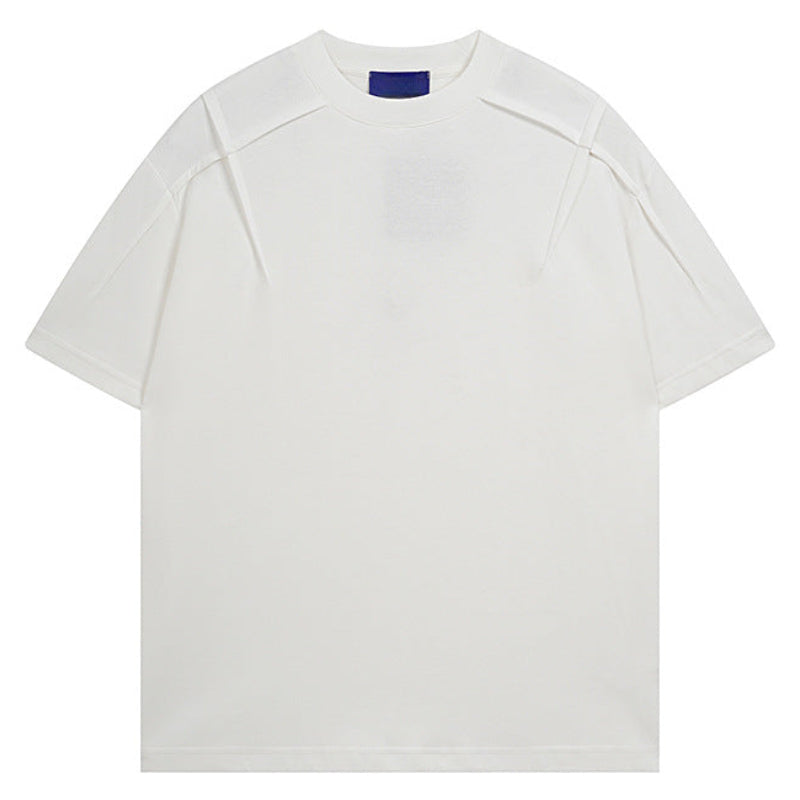 Shop the Architectural Pleat Drop Shoulder Tee by Teddy Blaze. Premium cotton-blend loose-fit t-shirt featuring diagonal chest pleat seams from THE IVY MAN.