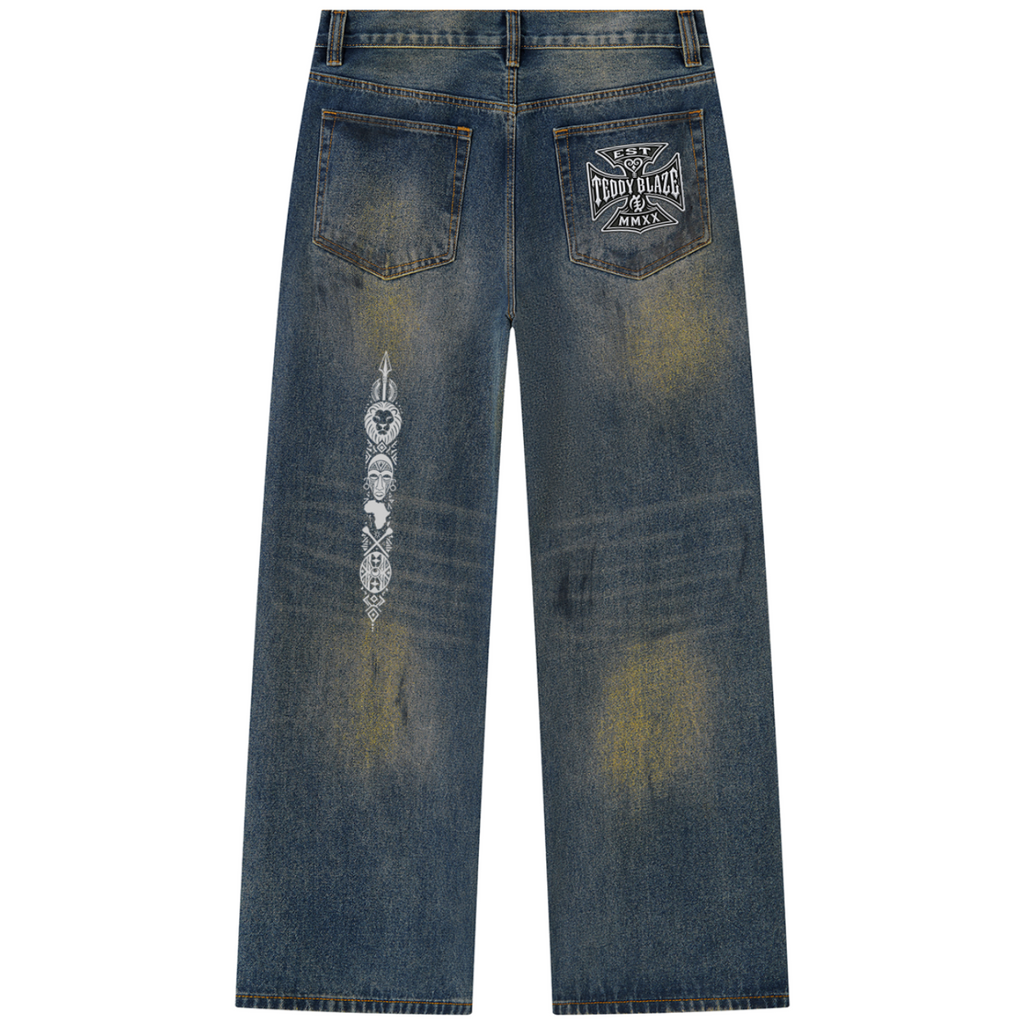 Shop DaCruz Afrodemia Vintage Wash Wide Leg Denim Jeans by Teddy Blaze, featuring heavyweight vintage-wash denim, DaCruz graphics and Afrocentric iconography.