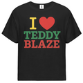 A black short-sleeve t-shirt with a graphic print reading 'I [heart] TEDDY BLAZE' in yellow, red, and green block letters, displayed on a solid white background.
