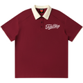 A short-sleeve polo shirt in maroon with a cream-colored collar and a white embroidered 'Teddy Blaze' logo on the left chest, displayed against a solid white background.