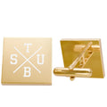 Gold cufflinks with baseball bat and ball design on a white background