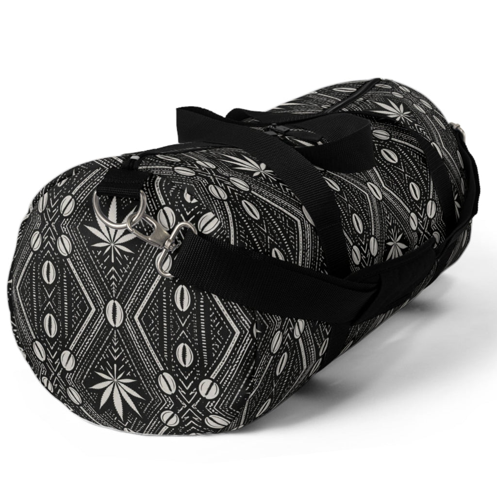 Meet the DaChek™ Getaway, a Teddy Blaze travel duffel featuring monochrome African-inspired patternwork, Oxford canvas, organized storage and an adjustable padded strap.