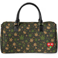 A dark green and black duffle bag with an all-over cannabis leaf pattern, featuring black leather handles and a red heart patch with a white cannabis leaf on the front right side, set against a plain white background.