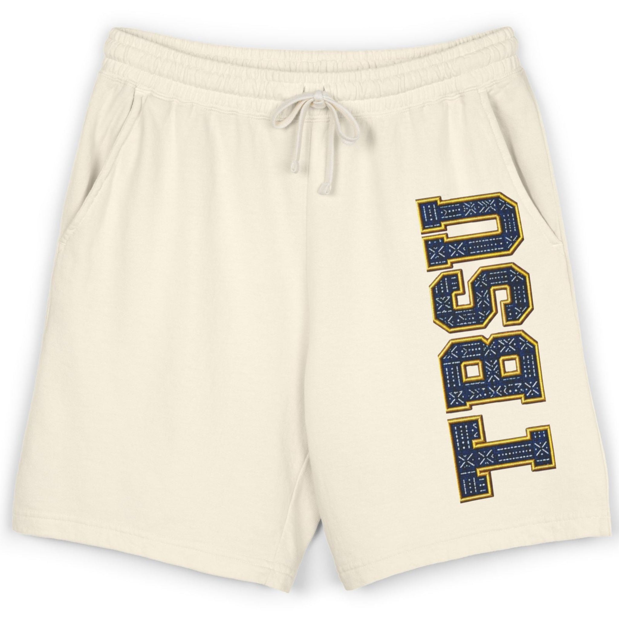 Cream-colored athletic shorts featuring a vertical 'USU 1851' graphic in navy blue and gold on the left leg, with a matching cream drawstring waistband.