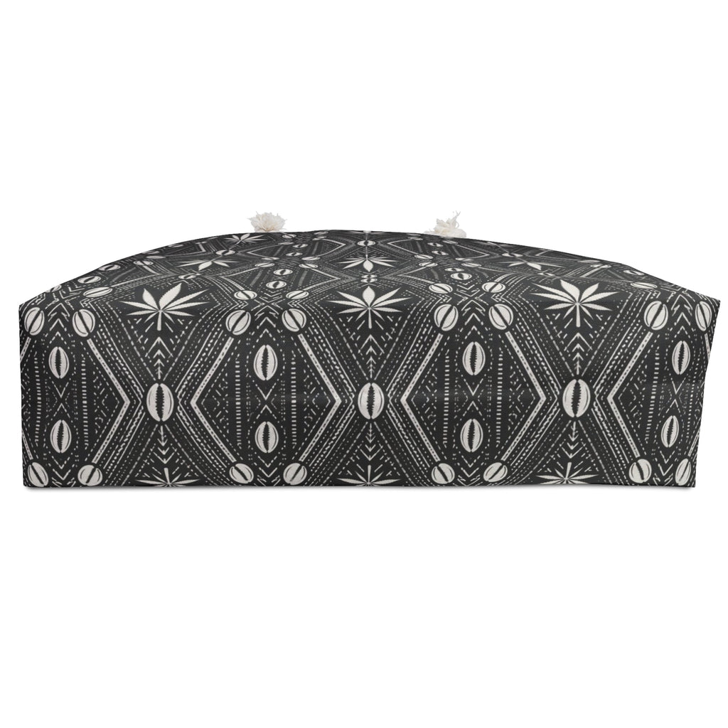 Travel with DaChek™. This oversized Teddy Blaze Weekender features bold black-and-white African-inspired patternwork, cotton rope handles, a lined interior and spacious T-bottom construction.