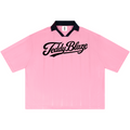 A light pink short-sleeve polo shirt with a black collar and a black 'TeddyBlaze' script logo across the chest, displayed flat against a white background.