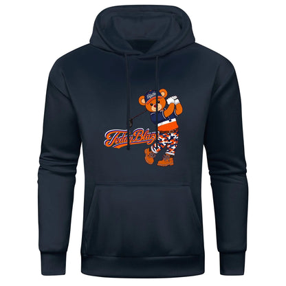 A soft cotton-blend hoodie featuring SDB in golfer mode with Signature artwork, front pocket, drawstring hood, and TBX Chelsea energy.
