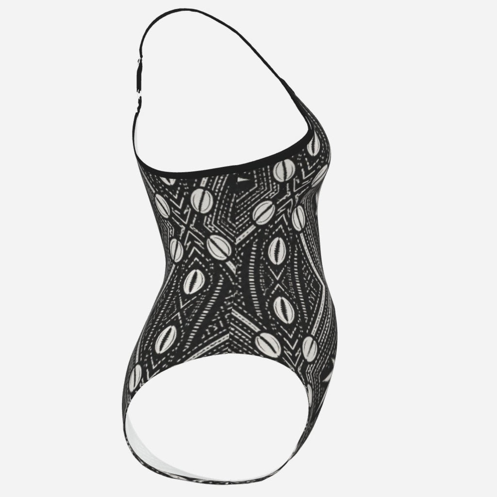 A Teddy Blaze™ spaghetti strap monokini in matte stretch swim fabric, finished with an open back and adjustable straps for poolside heat.