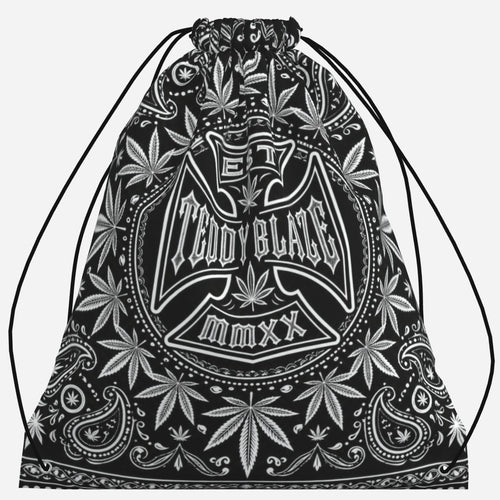 Lightweight black-and-white drawstring bag featuring the DaCruz Cross, TeddyFlora and paisley-inspired artwork by Teddy Blaze.