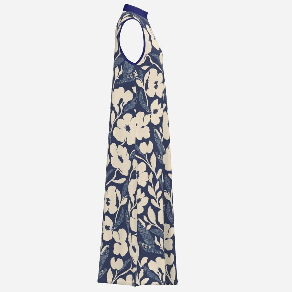 Teddy Blaze Adire floral A-line dress featuring an indigo and cream textile design, high neckline, ankle length silhouette, and Black Ivy elegance.
