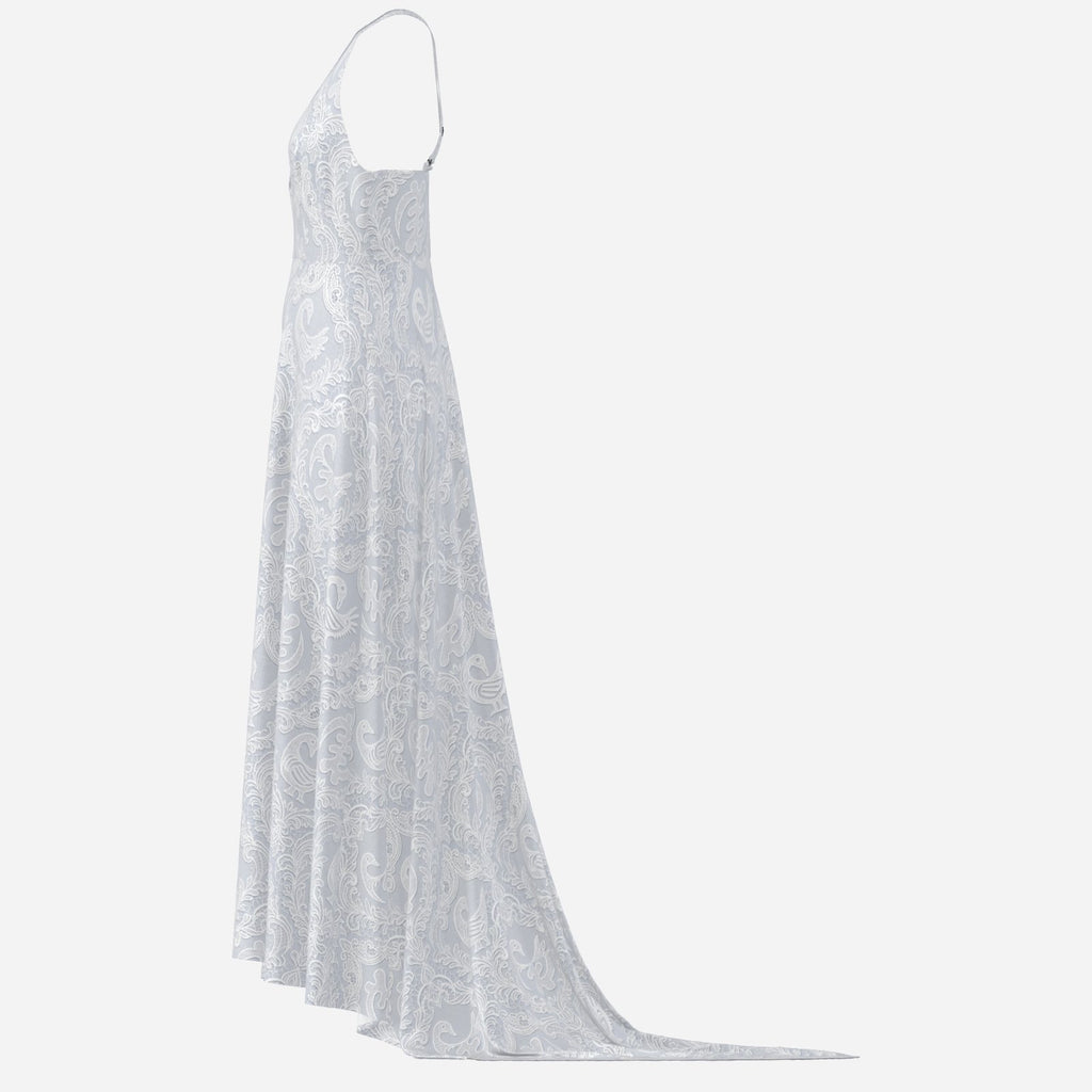 A statement Sankofa lace maxi dress featuring a deep V-neck, cross-back straps, and Teddy Blaze cultural textile design. Afrocentric luxury with modern fashion house energy.