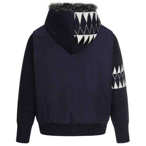 Elevate your luxury outerwear with the House of Teddy Blaze Hybrid Knit Faux Fur Hooded Jacket. Navy blue nylon and ribbed knit hybrid shell, insulated fill, faux fur hood lining, and geometric sleeve graphics. Shop NYC to Vegas style.