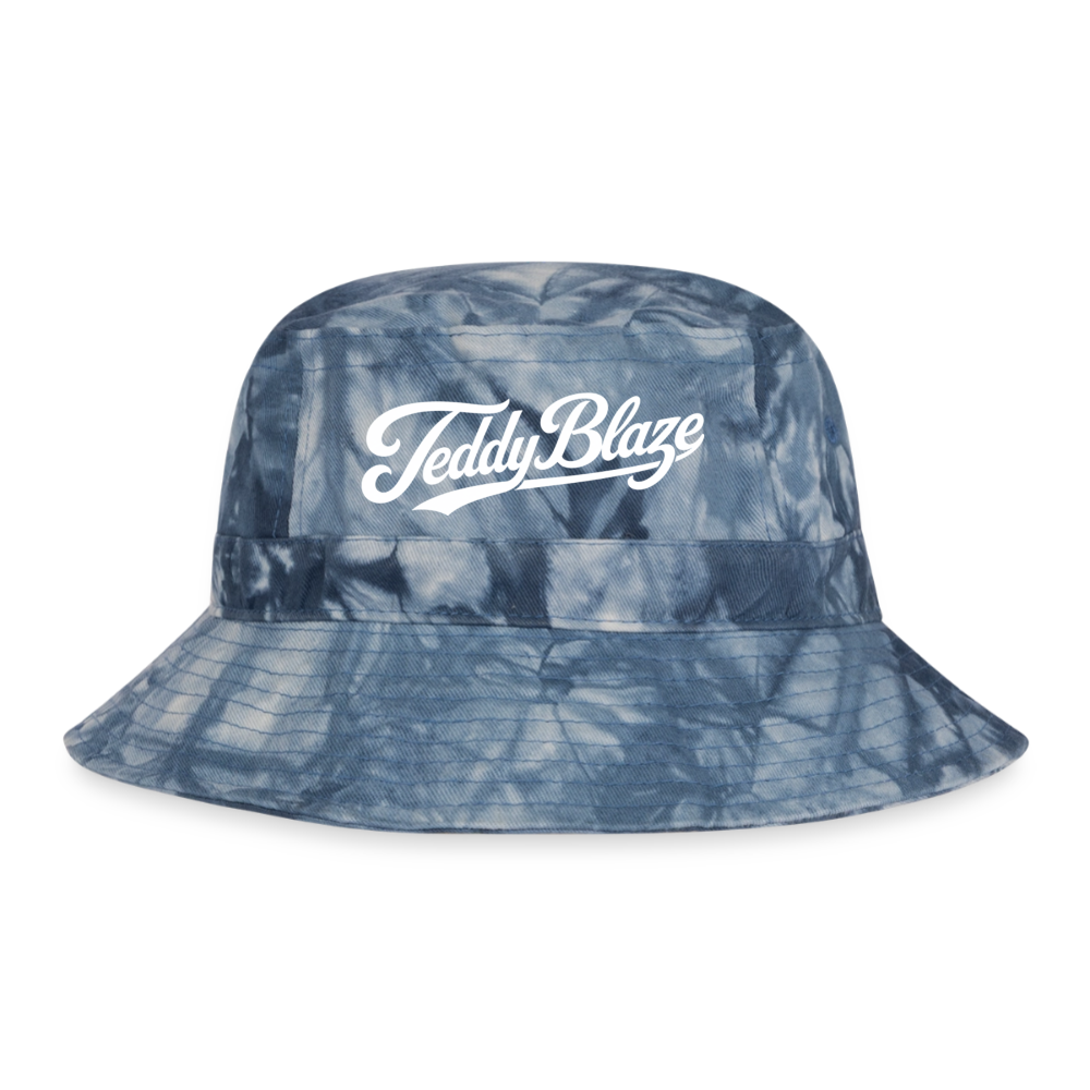 Blue tie-dye Teddy Blaze Signature Bucket Hat featuring a white script logo on the front, cotton twill construction, sewn eyelets, and crushable brim.