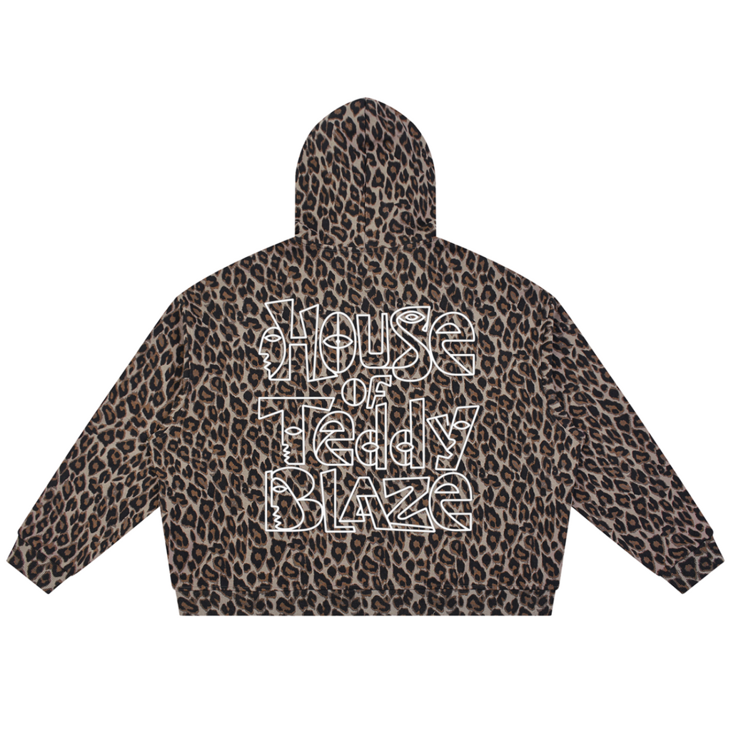 A cropped hoodie with a brown and black leopard print pattern, featuring the text 'House of Teddy Blaze' in a white outline font on the back.