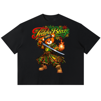 A black short-sleeve t-shirt with a colorful graphic of a cartoon bear wearing a green and gold Hawaiian shirt and holding a sword and flame, under the text 'Teemu Blaze'.