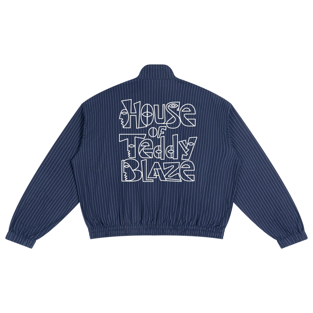 A navy blue pinstriped bomber jacket shown from the back, featuring 'House of Teddy Blaze' printed in a white outline font across the upper back.