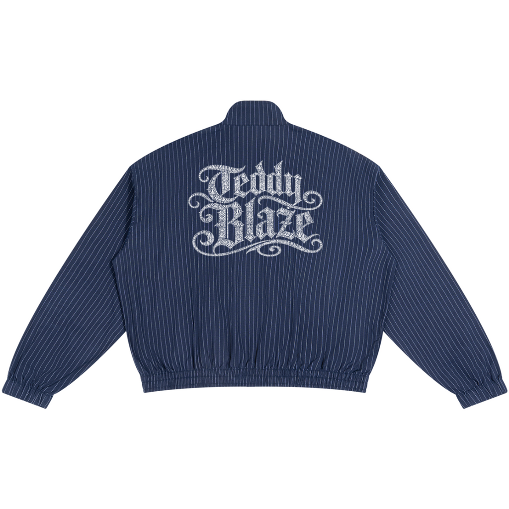 A navy blue pinstriped bomber jacket shown from the back, featuring a large white 'Teddy Blaze' logo printed across the upper back.