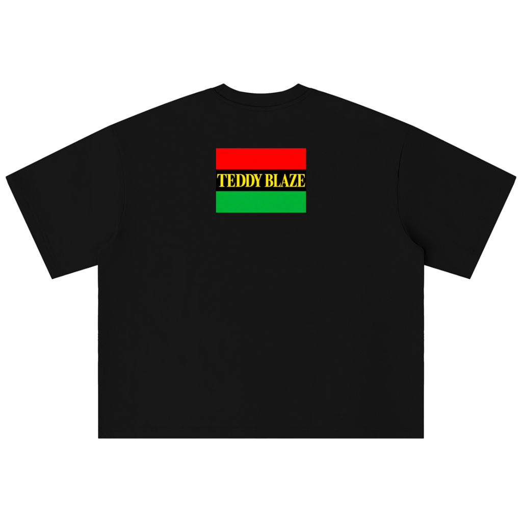 A black short-sleeve t-shirt with a graphic on the chest featuring the text 'TEDDY BLAZE' in yellow between red and green horizontal stripes, displayed on a solid white background.