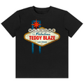 A black short-sleeve crewneck t-shirt featuring a vintage-style 'Welcome to Fabulous Teddy Blaze Las Vegas' sign graphic printed on the chest.