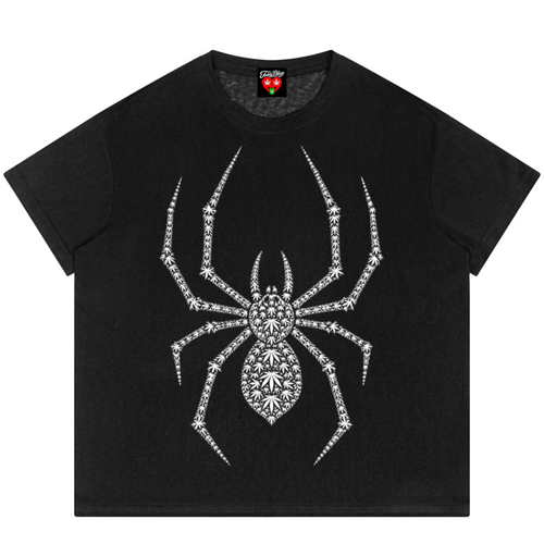 A black short-sleeve t-shirt featuring a large, detailed spider graphic on the front, composed of sparkling rhinestones. The shirt is displayed flat against a solid white background.