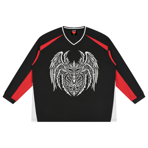 A black long-sleeve athletic jersey with red shoulder and sleeve panels, featuring a large white tribal-style winged demon head graphic on the chest.