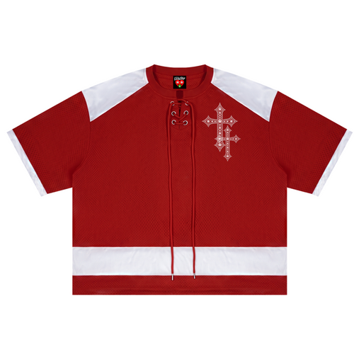 A red short-sleeve hockey-style jersey top with white shoulder and hem panels, lace-up front detailing, and a white ornate cross graphic on the left chest, shown on a plain white background.