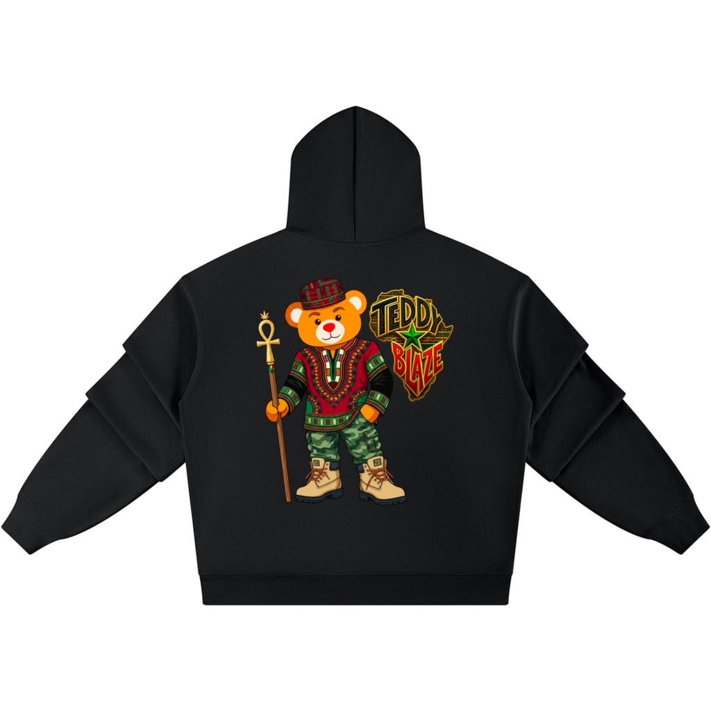 A black pullover hoodie shown from the back, featuring a large graphic print of a teddy bear dressed in medieval attire holding a staff, with a shield that reads 'TEDDY BURG'.