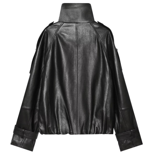 Shop the Iron + Ivy Double-Breasted Leatherette Funnel Jacket by Teddy Blaze. Women’s oversized black PU leather jacket featuring a high stand collar, raglan sleeves, and buckle cuff details.