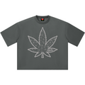 A dark gray short-sleeve t-shirt with a large white line-art cannabis leaf graphic printed on the front, displayed flat against a solid white background.