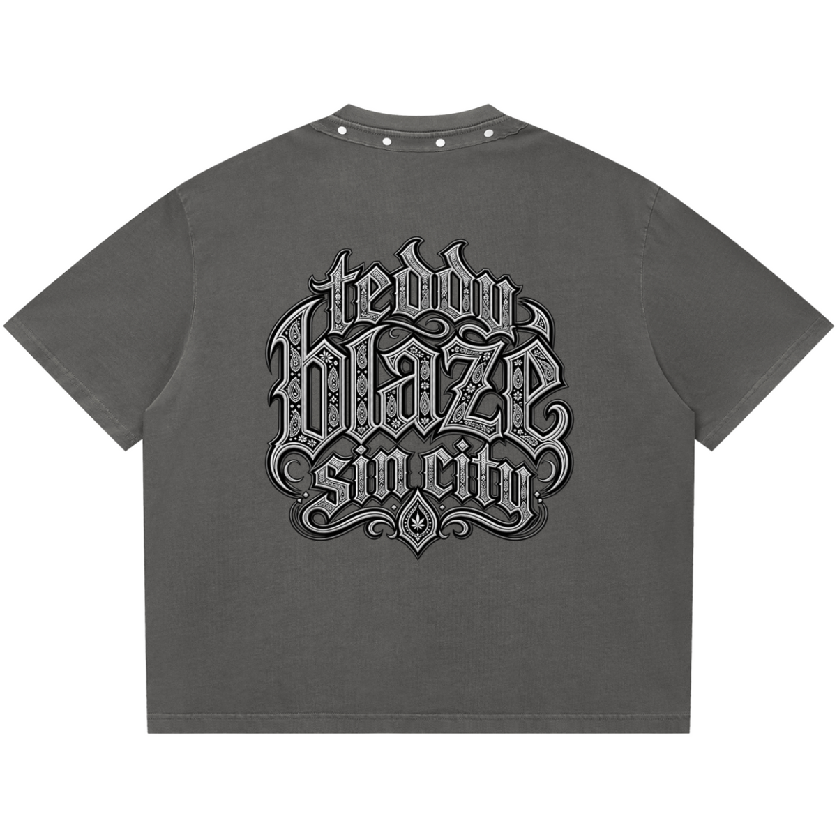 Elevate your boxy graphic tees with the Teddy Blaze Sin City Sacred Snow Wash Studded Cotton Tee. Charcoal snow-washed cotton, metal studded collar, and tattoo praying hands print. Shop NYC to Vegas style.
