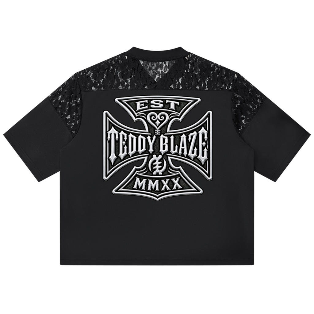 A black short-sleeve t-shirt with a large white 'Teddy Blaze' graphic on the front and black lace panels on the shoulders, shown against a plain white background.