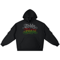 A black pullover hoodie with a graphic on the chest reading 'Teddy Plaza' in stylized white, red, and green lettering, shown on a plain white background.