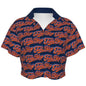 A cropped camp shirt with an allover Signature pattern, short sleeves, V-neck button front, and lightweight stretch fabric for BK summer styling.