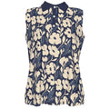 Shop the Adire Florale Sleeveless Golf Polo by Teddy Blaze. Lightweight 145g/m² performance fabric with a contrast collar and botanical Adire-inspired print.