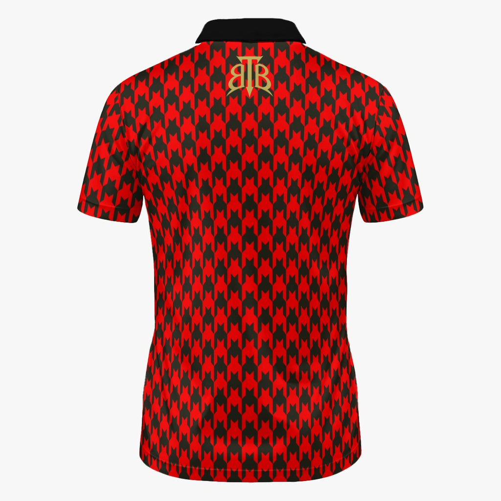 Shop the Scarlet Hound Polo by Teddy Blaze. 200 GSM Birdseye performance poly polo featuring a red and black houndstooth pattern from The Mature Mocha Collection.