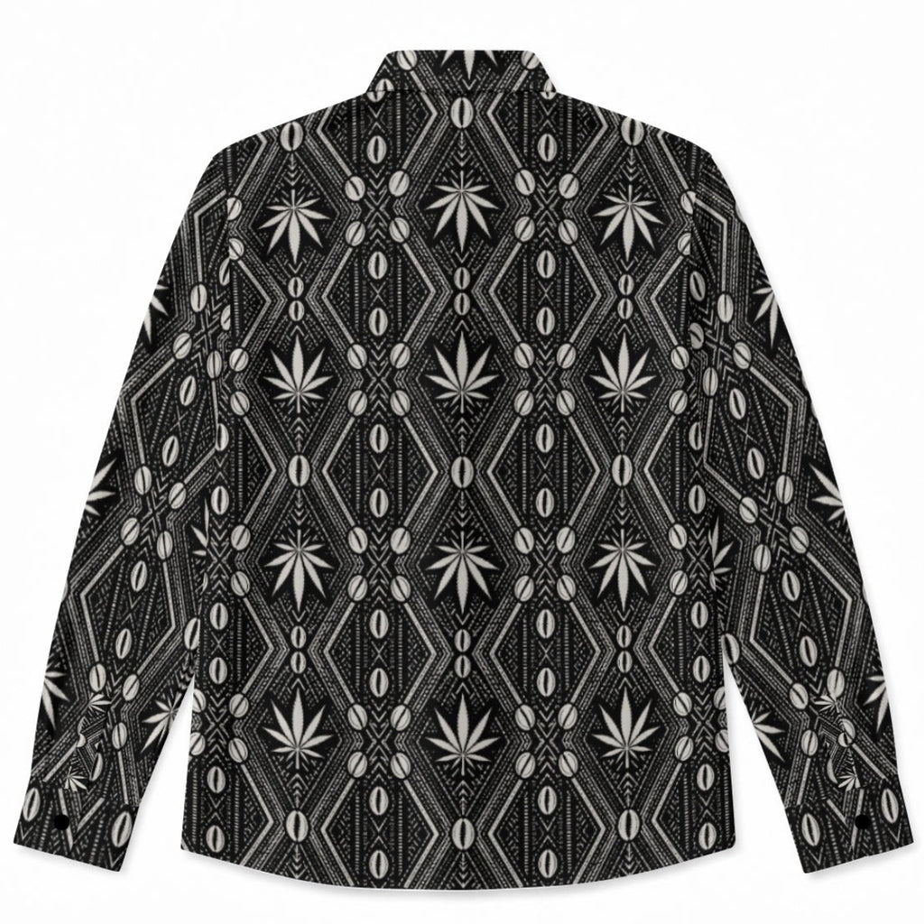 A long-sleeve button-up shirt with a black and white geometric pattern featuring diamond grids, vertical lines, and stylized cannabis leaf motifs, displayed flat against a white background.
