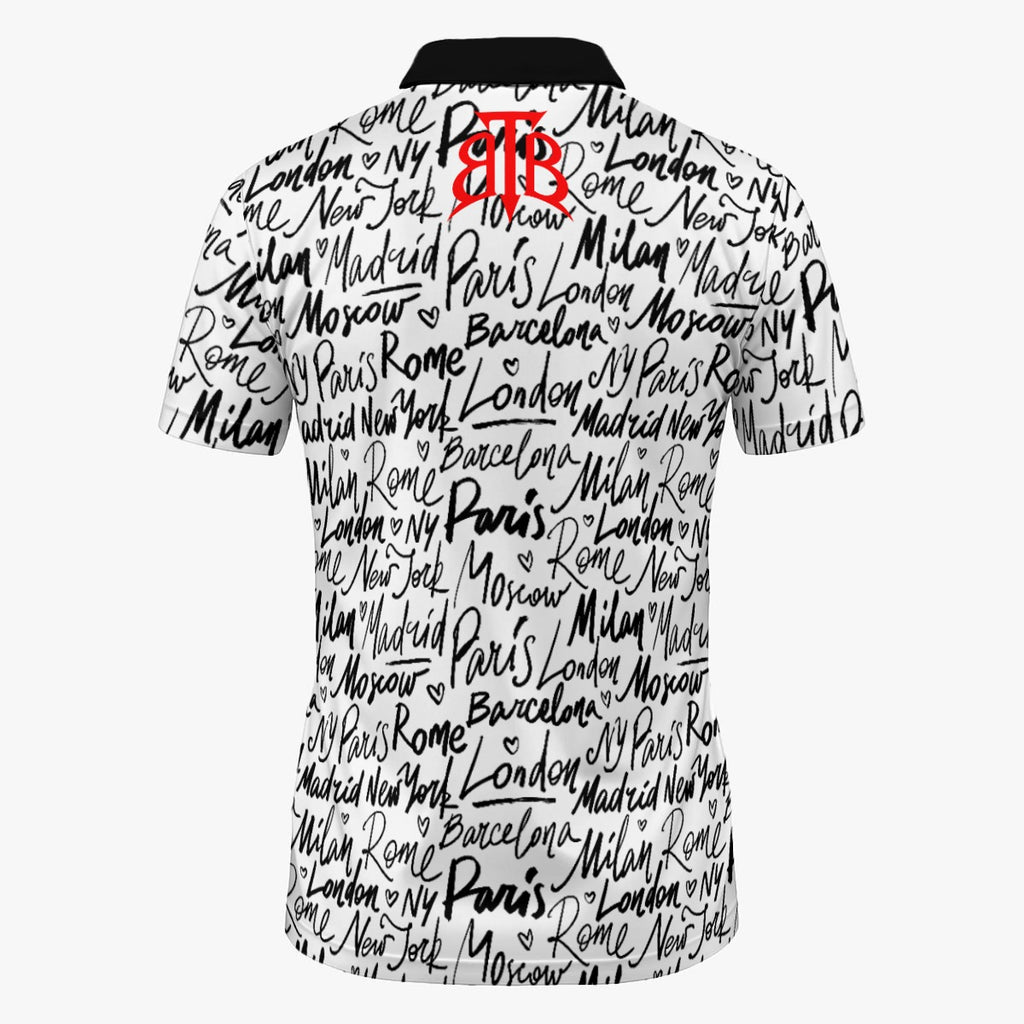 Shop the Jet Setter Polo by Teddy Blaze. 200 GSM performance poly polo with global city script print and crimson placket from The Mature Mocha Collection.