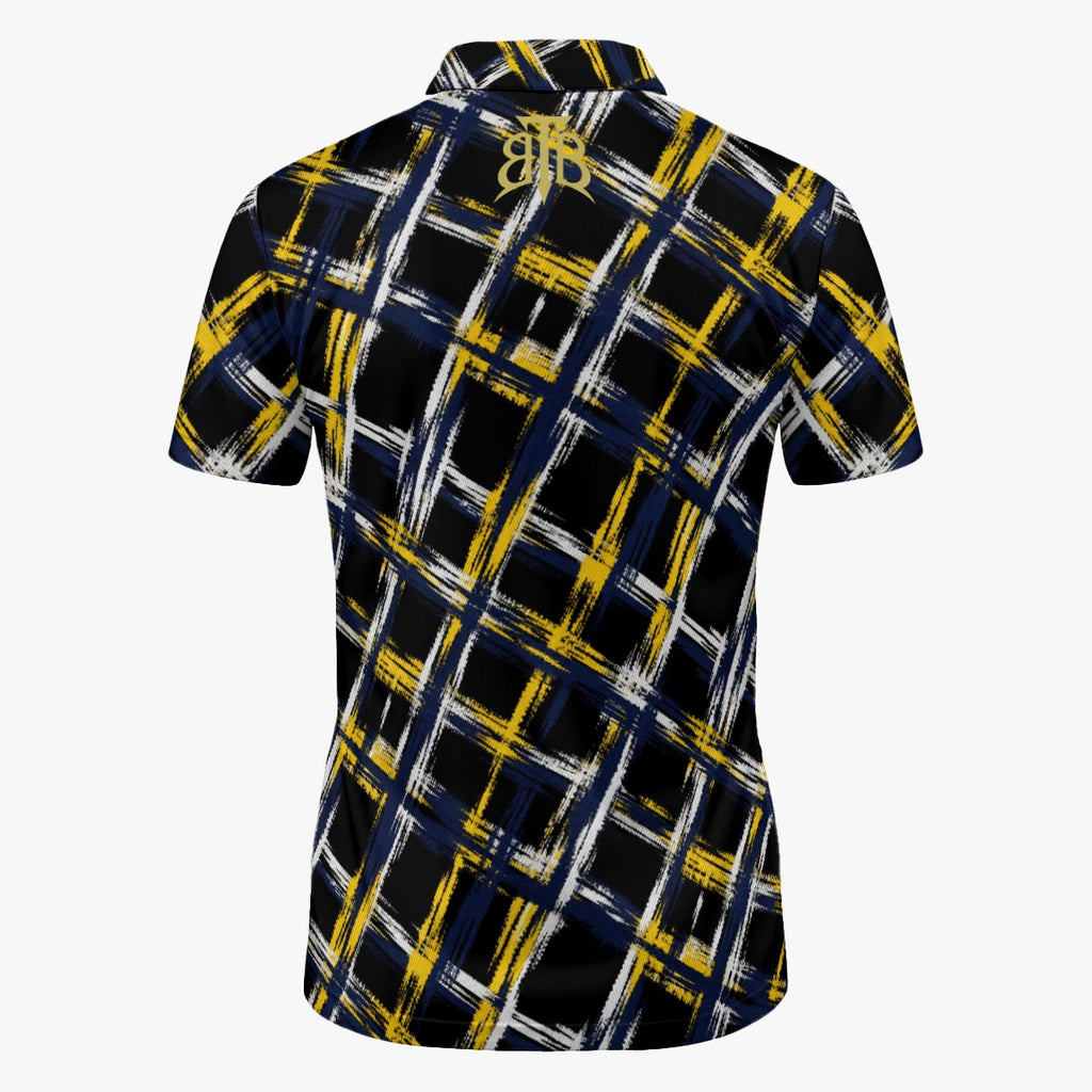A short-sleeve collared shirt shown from the back, featuring a black base with a bold plaid pattern made of yellow and white brushstroke lines. A stylized gold 'JB' monogram is printed at the center of the back collar.