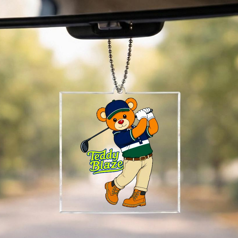 Car rearview mirror with a teddy bear-themed ornament labeled 'Teddy Blaze'.