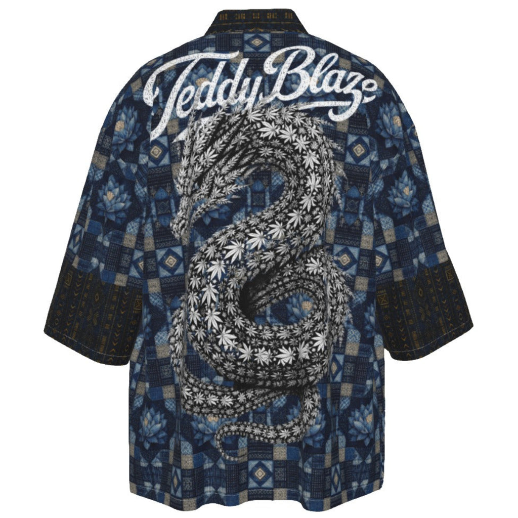 A short-sleeve button-up shirt shown from the back, featuring a large black and white snake graphic with cannabis leaves, the text 'Teddy Blaze' in white script, and a blue geometric patterned background.