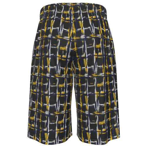 A pair of wide-leg shorts featuring a dark charcoal gray base with an abstract grid pattern in yellow and white, displayed against a solid white background.