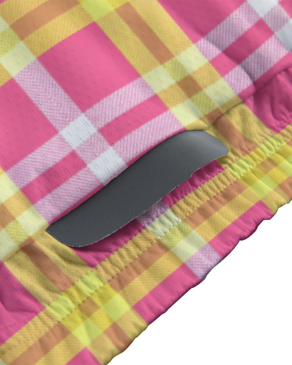 A close-up of a pink, yellow, and white plaid fabric item with a gray elastic band, shown against a white background.