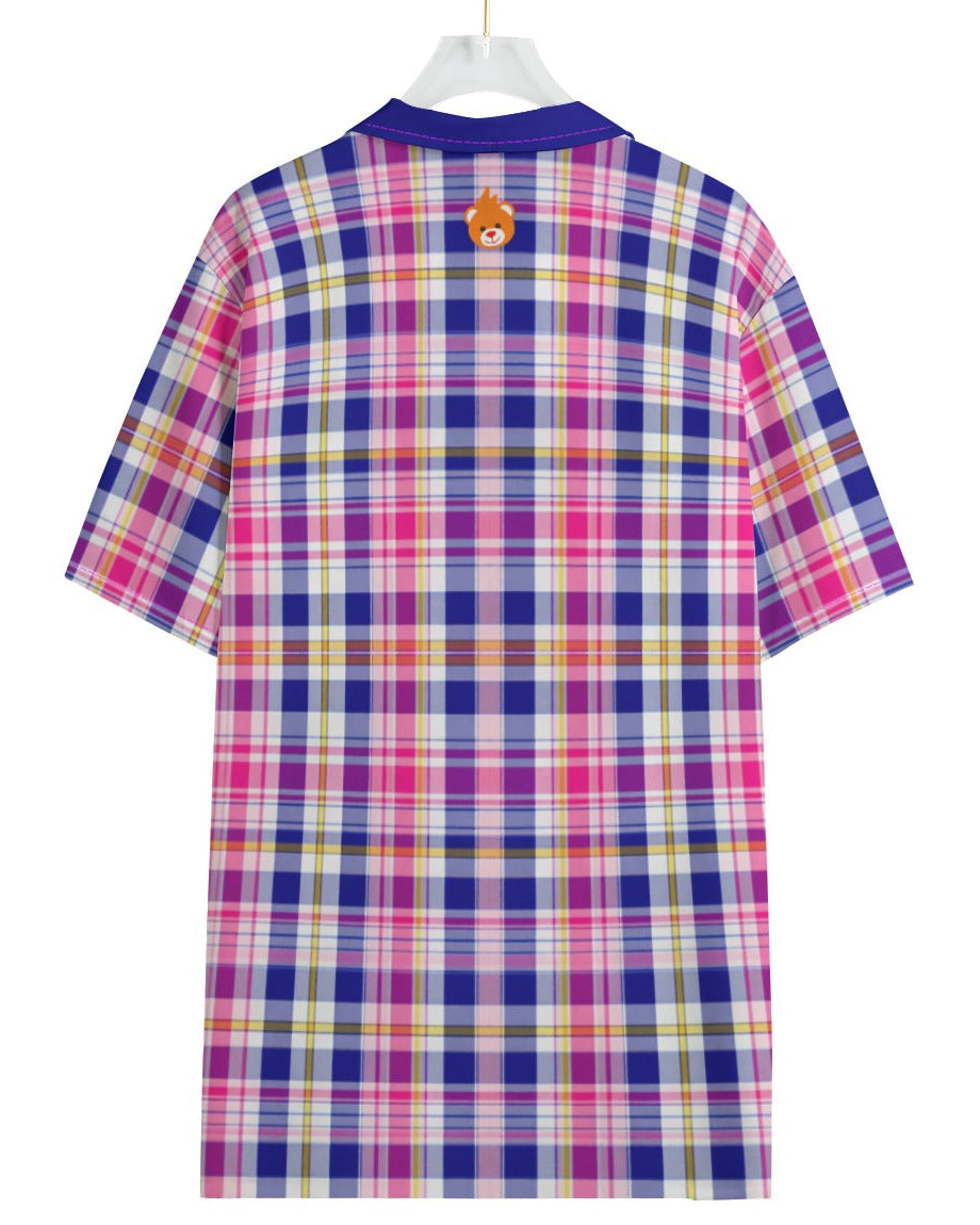 A short-sleeve plaid t-shirt shown from the back, hanging on a white hanger against a plain white background. The shirt features a vibrant plaid pattern with pink, purple, blue, yellow, and white stripes, and has a small orange circular graphic on the upper back.