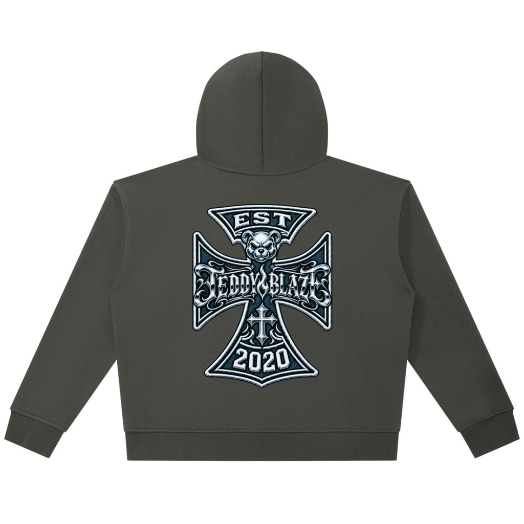 Shop the Fuego Cruz Heavy Cotton Zip Hoodie by Teddy Blaze. Heavyweight 420 gsm cotton full-zip hoodie with gothic chest script and DaCruz back crest.